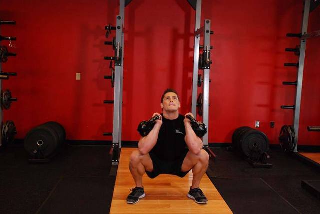 Front squat con manubri: Arrivo
